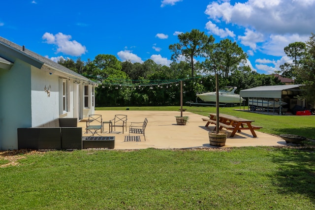 view of community with a patio area and a yard