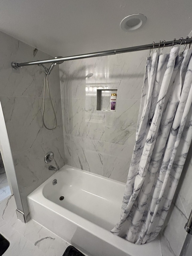 bathroom with shower / tub combo