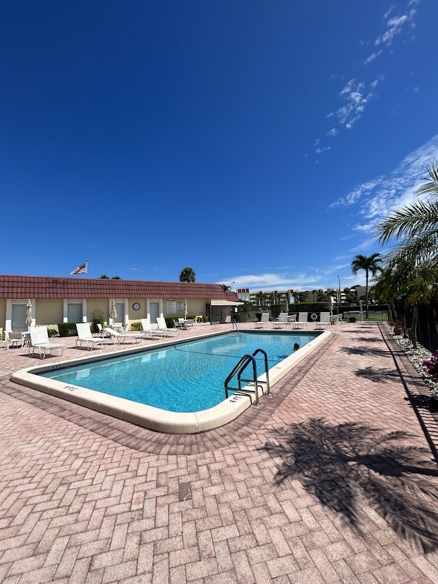 view of swimming pool featuring a patio area