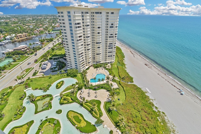 bird's eye view with a water view and a beach view