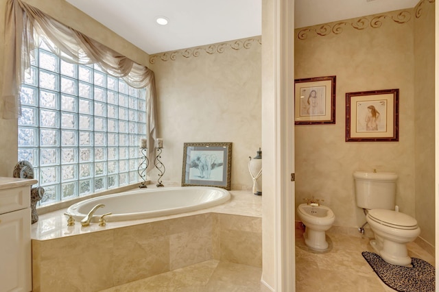 full bathroom with tile patterned flooring, a bidet, a garden tub, and toilet