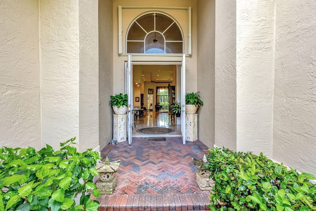 doorway to property with stucco siding