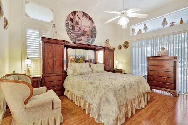 bedroom with ceiling fan and light wood-type flooring