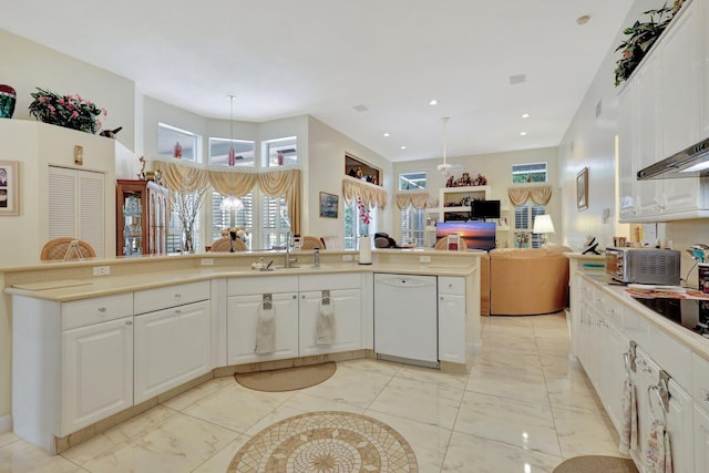 kitchen with black electric cooktop, decorative light fixtures, dishwasher, and white cabinets