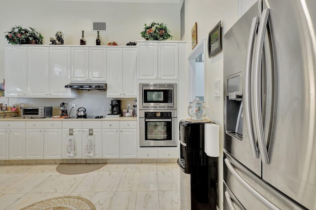 kitchen with white cabinets and appliances with stainless steel finishes