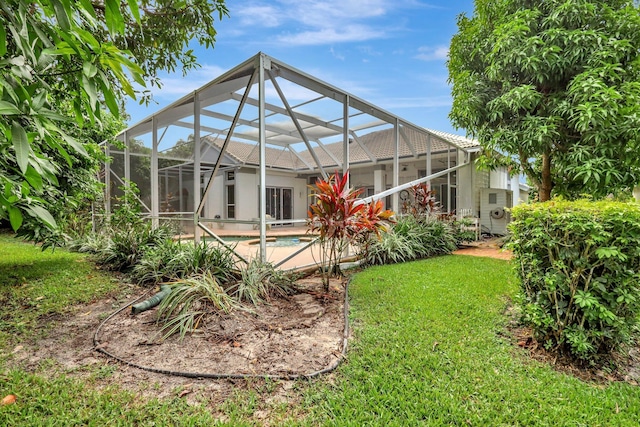 view of yard featuring glass enclosure