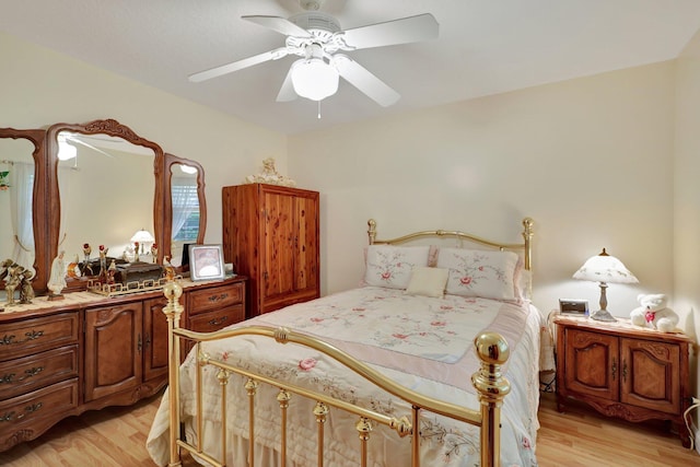 bedroom with light hardwood / wood-style floors and ceiling fan