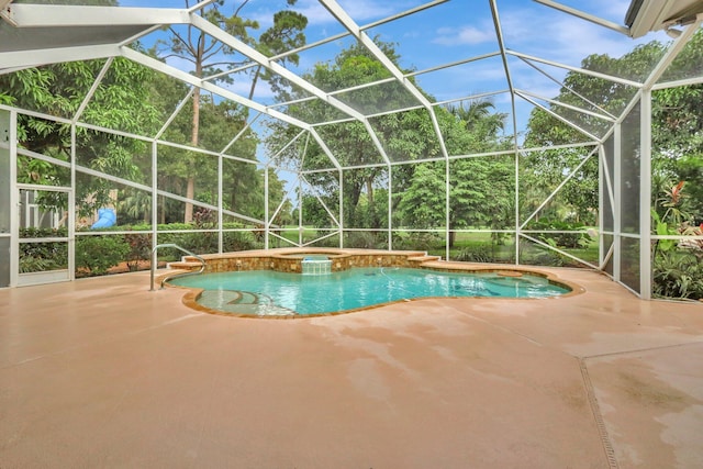 view of swimming pool with glass enclosure and a patio