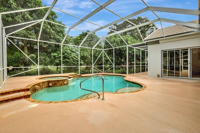 view of pool featuring a lanai, a patio, and an in ground hot tub