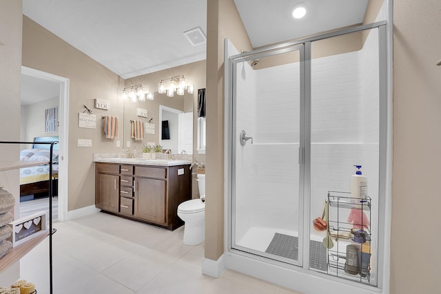 bathroom with vanity, tile patterned flooring, a shower with shower door, and toilet