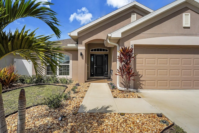 doorway to property featuring a garage