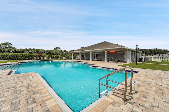 view of swimming pool featuring a patio area