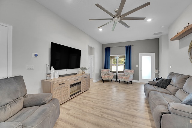 living room featuring light hardwood / wood-style floors and ceiling fan