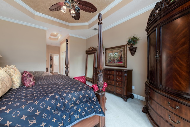 bedroom with crown molding, ceiling fan, a raised ceiling, and light carpet