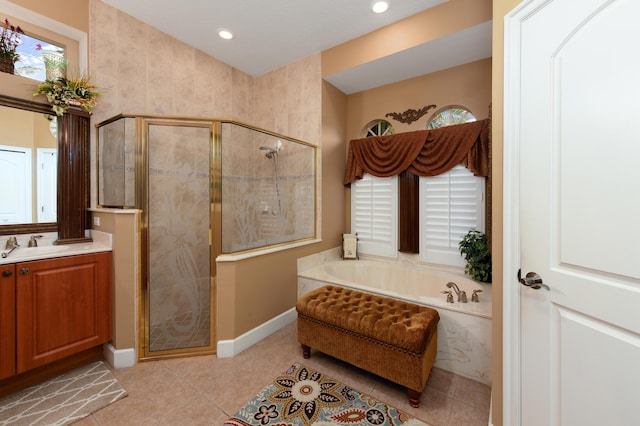 bathroom with vanity, tile patterned flooring, and shower with separate bathtub