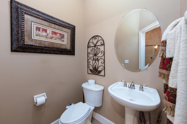 bathroom with toilet and sink