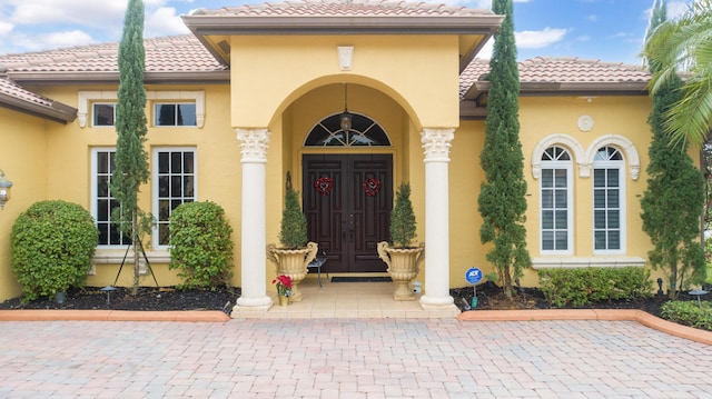 property entrance featuring french doors