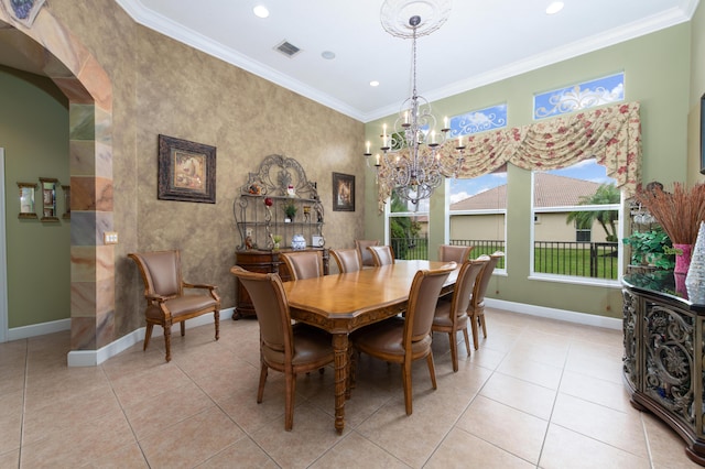 tiled dining room with crown molding and a chandelier