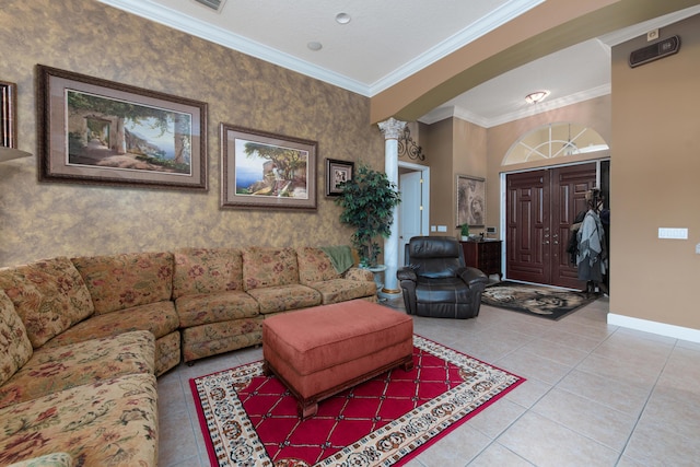 living room with light tile patterned floors, ornamental molding, and decorative columns