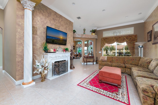 living room with ornate columns, ornamental molding, and tile patterned floors