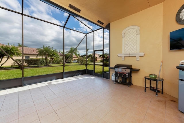 unfurnished sunroom with lofted ceiling