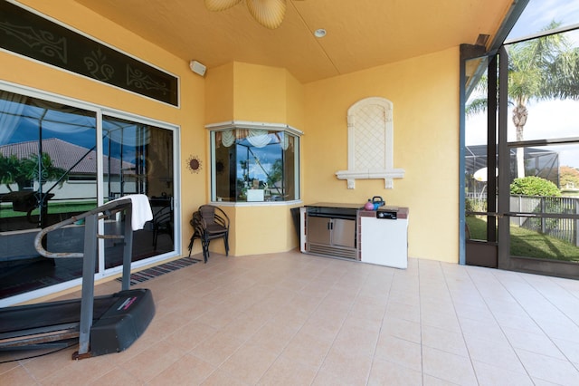 view of patio featuring a lanai