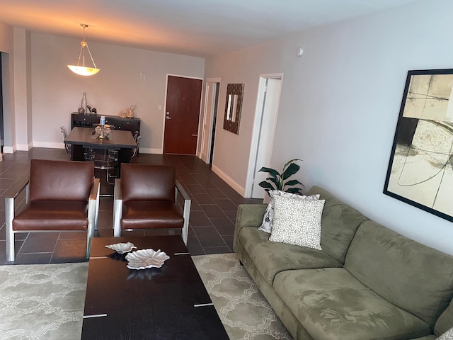 living room featuring dark tile patterned flooring