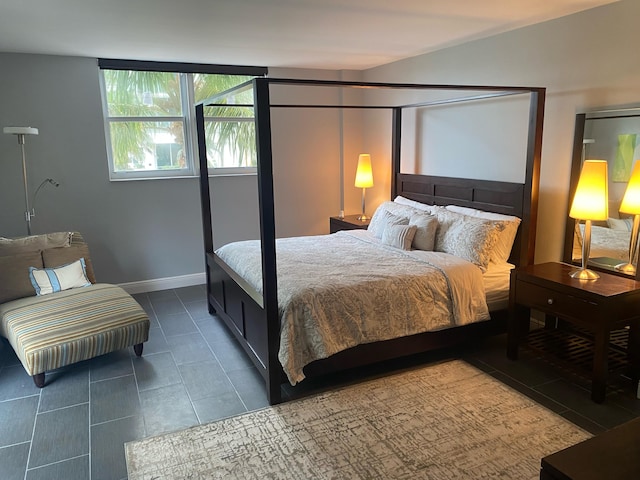 bedroom featuring dark tile patterned flooring