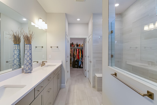 bathroom with vanity and an enclosed shower