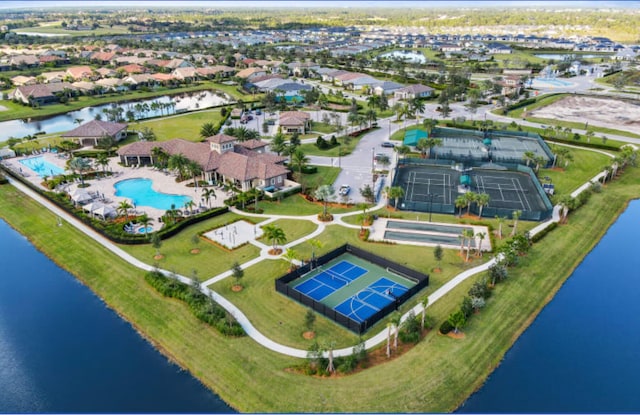 birds eye view of property featuring a water view