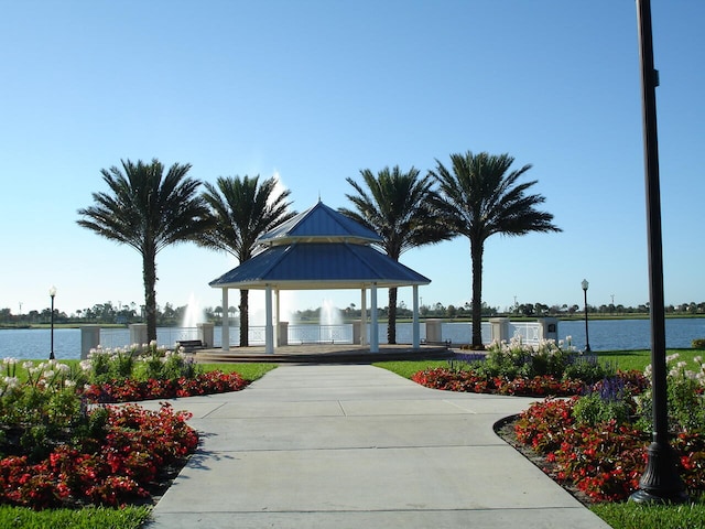 view of community with a gazebo and a water view