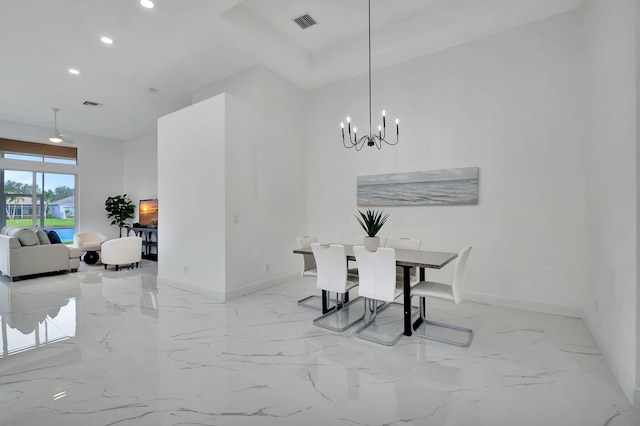 dining space featuring a chandelier