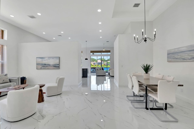 dining space with a notable chandelier