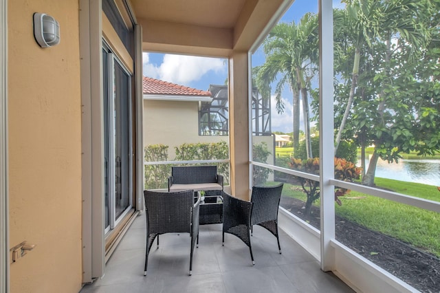 sunroom with a water view