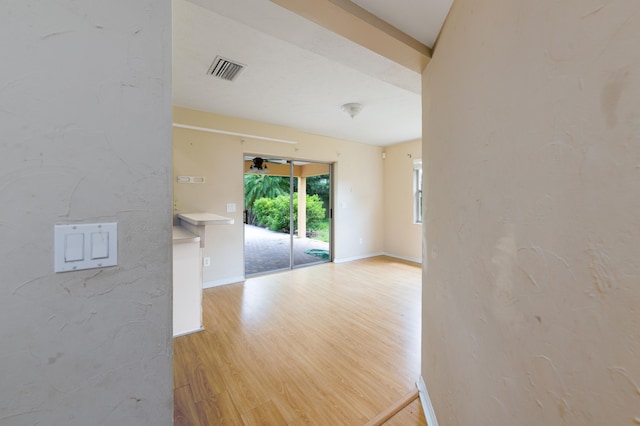 spare room with wood-type flooring