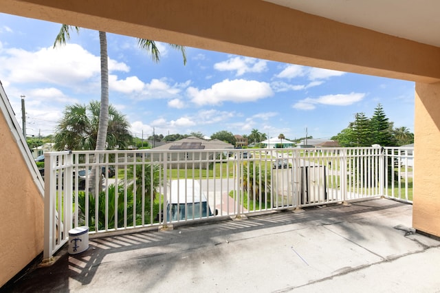 view of patio featuring a balcony