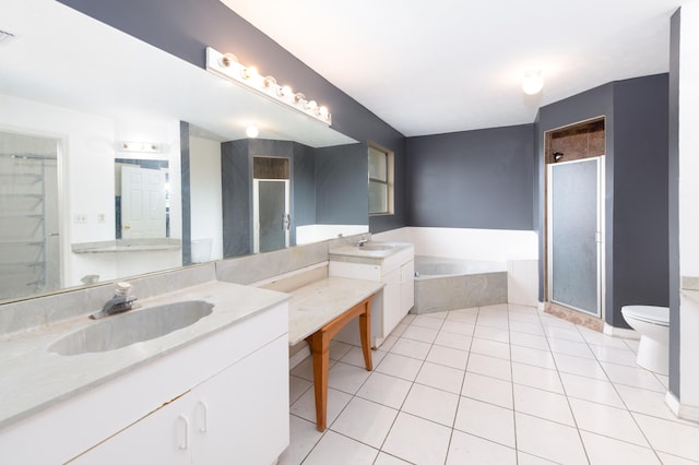 full bathroom with toilet, independent shower and bath, vanity, and tile patterned flooring