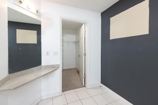 bathroom with tile patterned floors