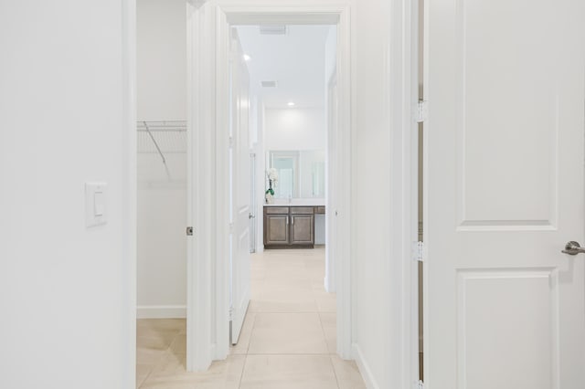 hallway with light tile patterned floors