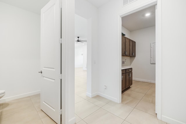 hall featuring light tile patterned flooring