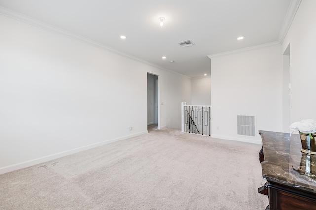 empty room with carpet and crown molding