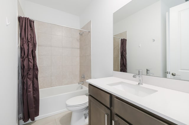 full bathroom featuring tile patterned flooring, vanity, toilet, and shower / bath combo with shower curtain