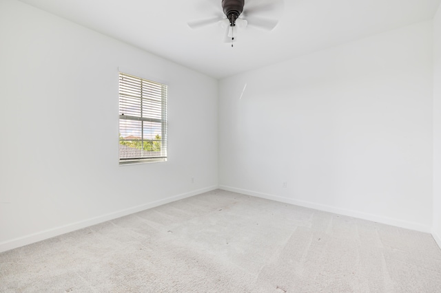 unfurnished room with light carpet and ceiling fan