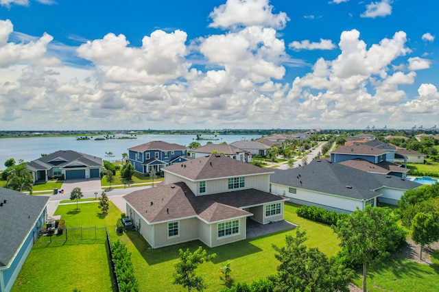 birds eye view of property featuring a water view