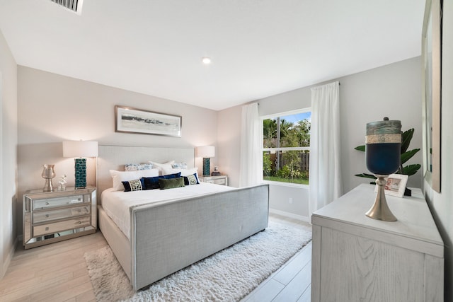 bedroom with light wood-type flooring