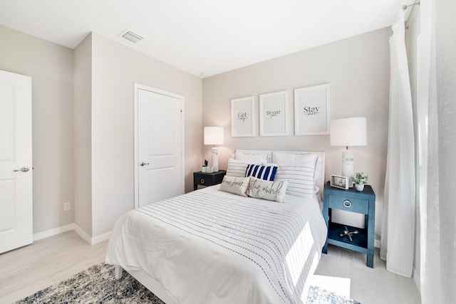 bedroom featuring light wood-type flooring