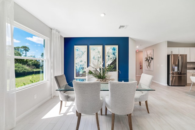 dining room with light hardwood / wood-style flooring