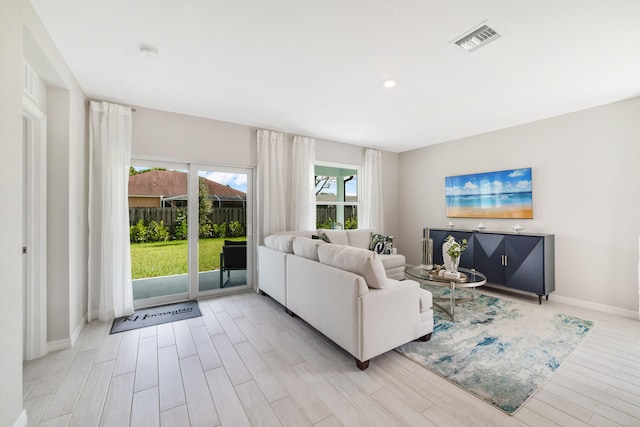 living room with light hardwood / wood-style flooring