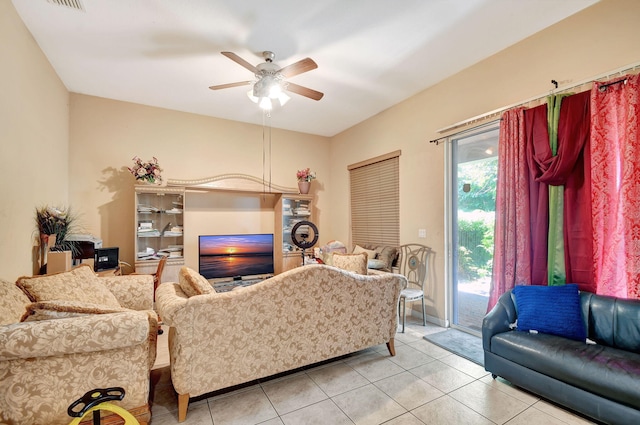 tiled living room featuring ceiling fan