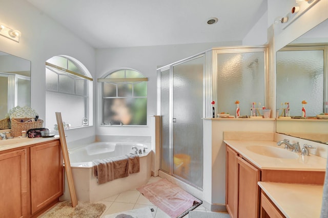 bathroom with vanity, shower with separate bathtub, and tile patterned flooring